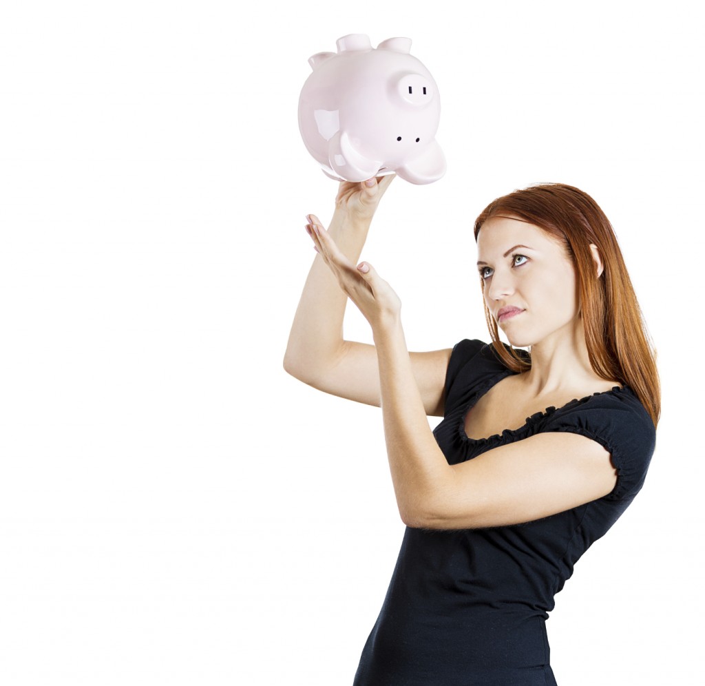 Woman holding piggy bank