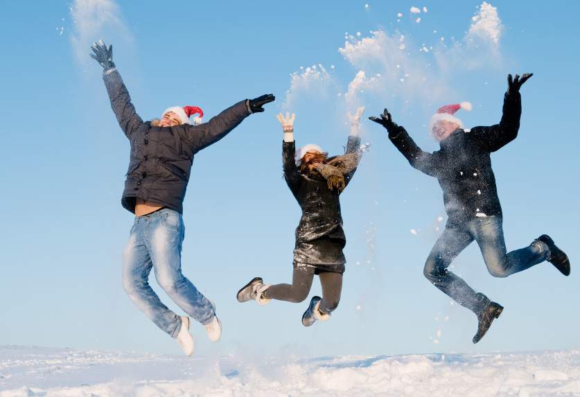 happy people jumping in winter