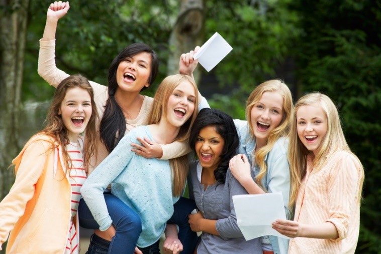 University students celebrating excellent results