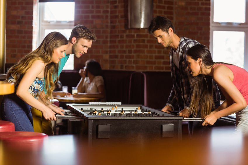 Students Playing Table Football