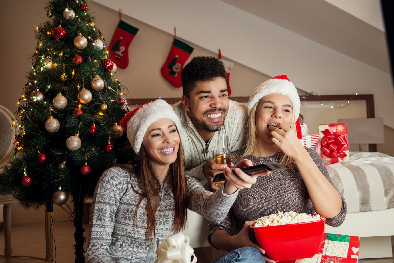 flatmates watching tv on christmas