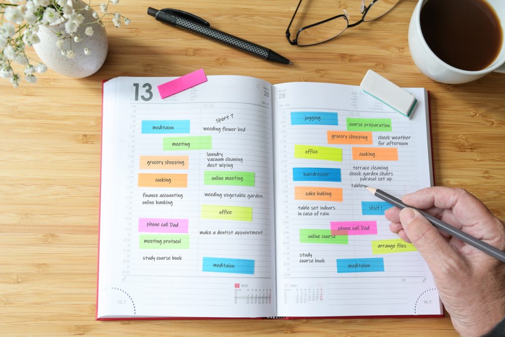 University student planner with post-it-notes and highlights
