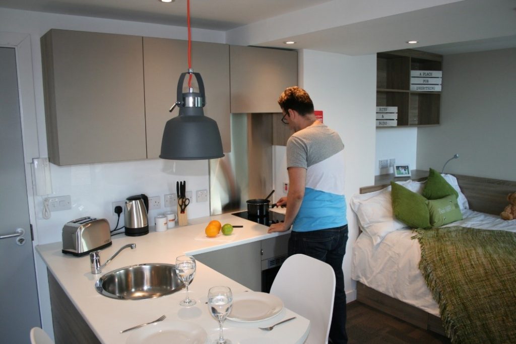 Student cooking in a kitchen