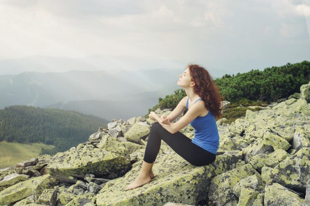 Woman feel freedom and enjoy the beautiful view in the mountains